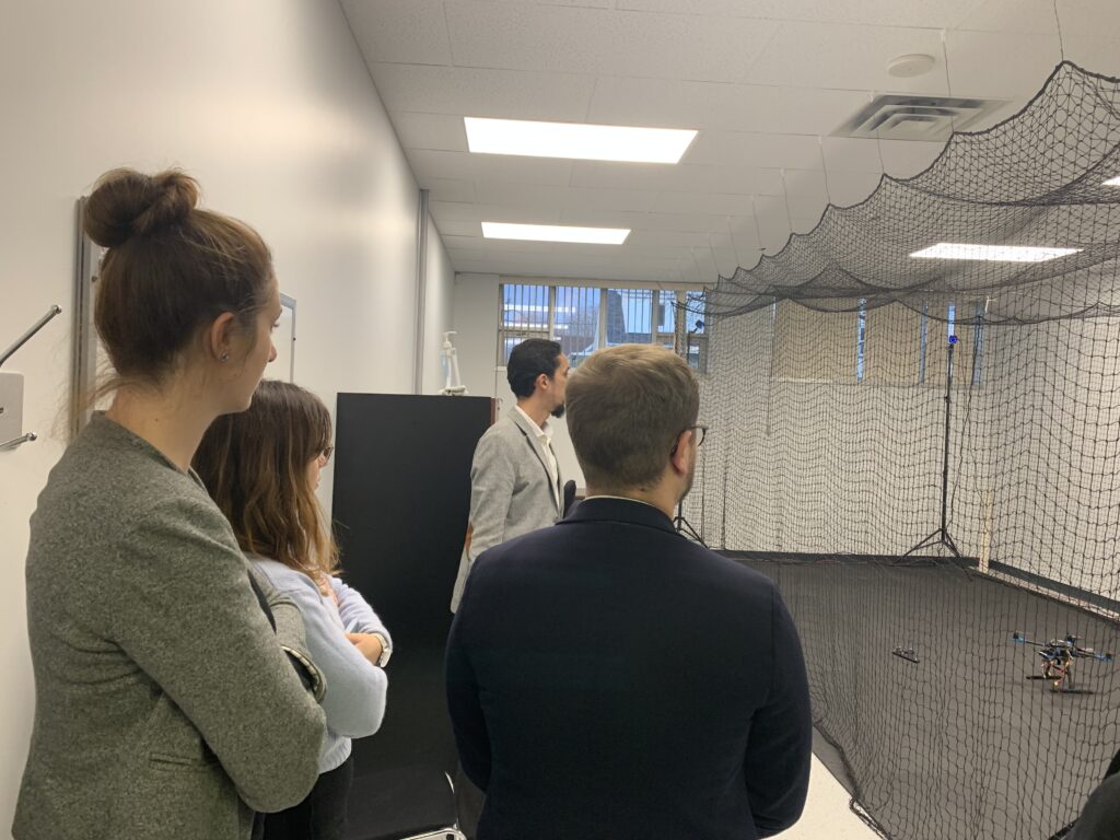 Dr. Berkane explaining LARSA Laboratory research activities to a visiting group from CRIAQ